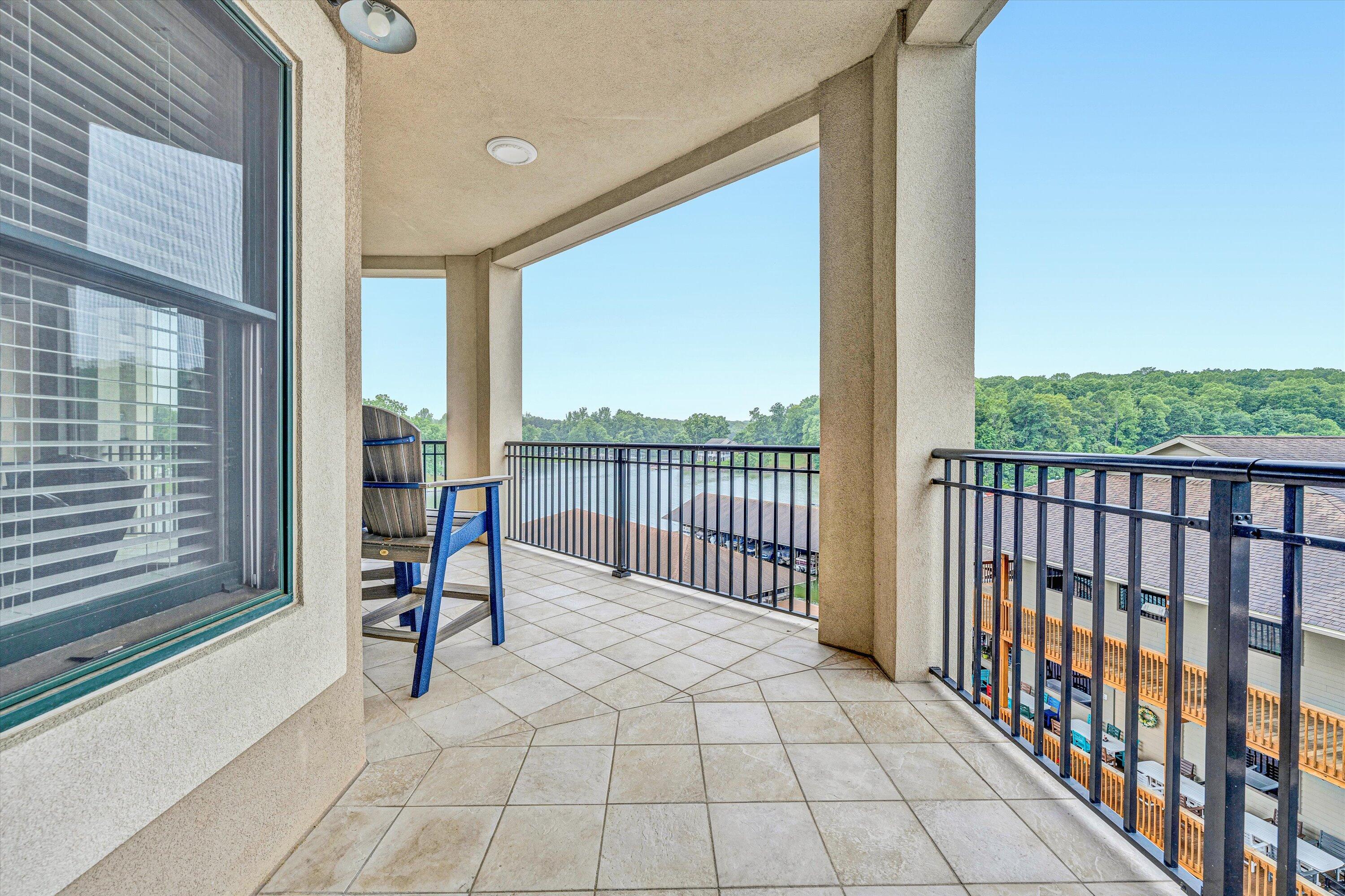 100 Bridgewater Pointe Place, Unit 401 Moneta, VA 24121 - Photo 21 of 39 a view of a room with wooden floor and iron stairs