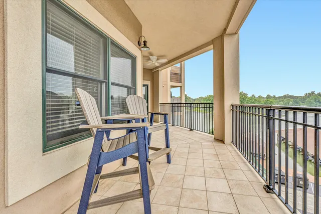 a view of a balcony with chairs