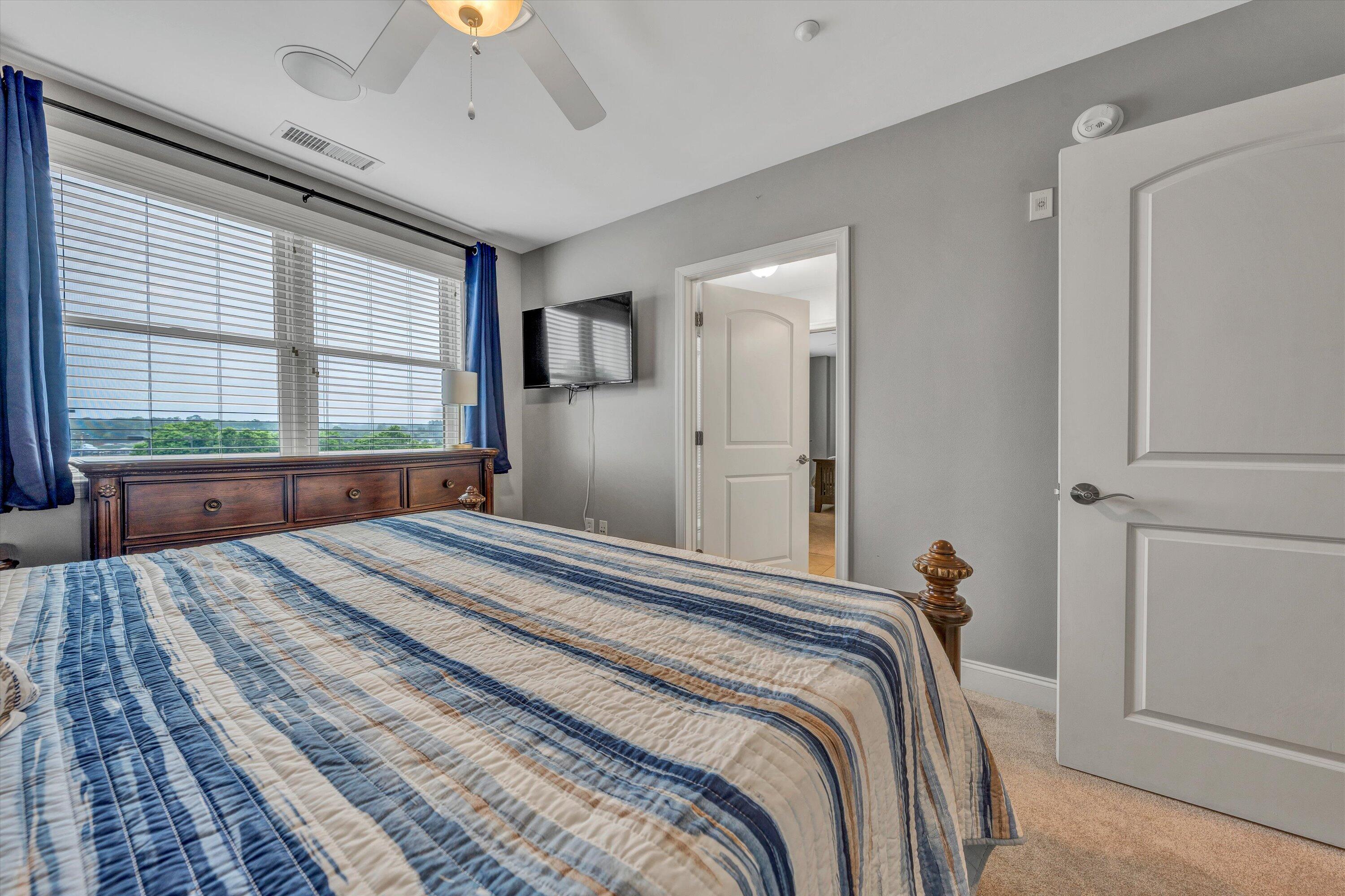 100 Bridgewater Pointe Place, Unit 401 Moneta, VA 24121 - Photo 30 of 39 a bedroom with a bed and a window