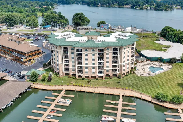 an aerial view of a house with a lake view
