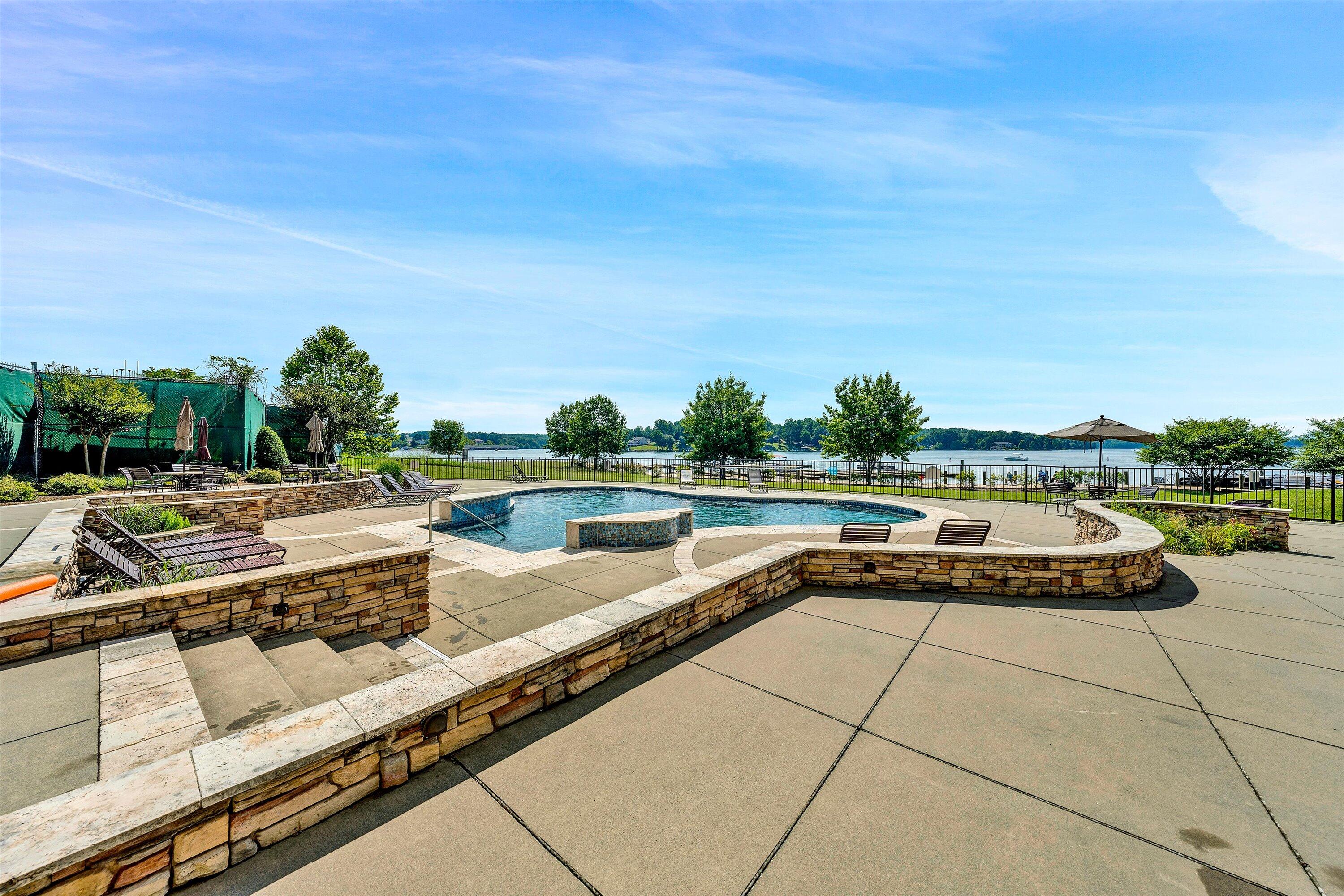 100 Bridgewater Pointe Place, Unit 401 Moneta, VA 24121 - Photo 38 of 39 a view of swimming pool with outdoor seating and plants