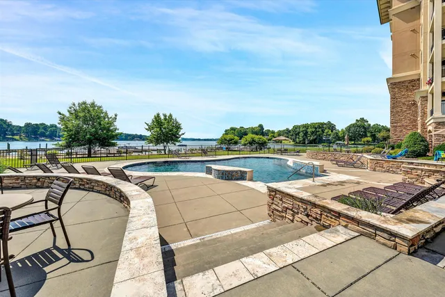 a view of a swimming pool and lounge chair