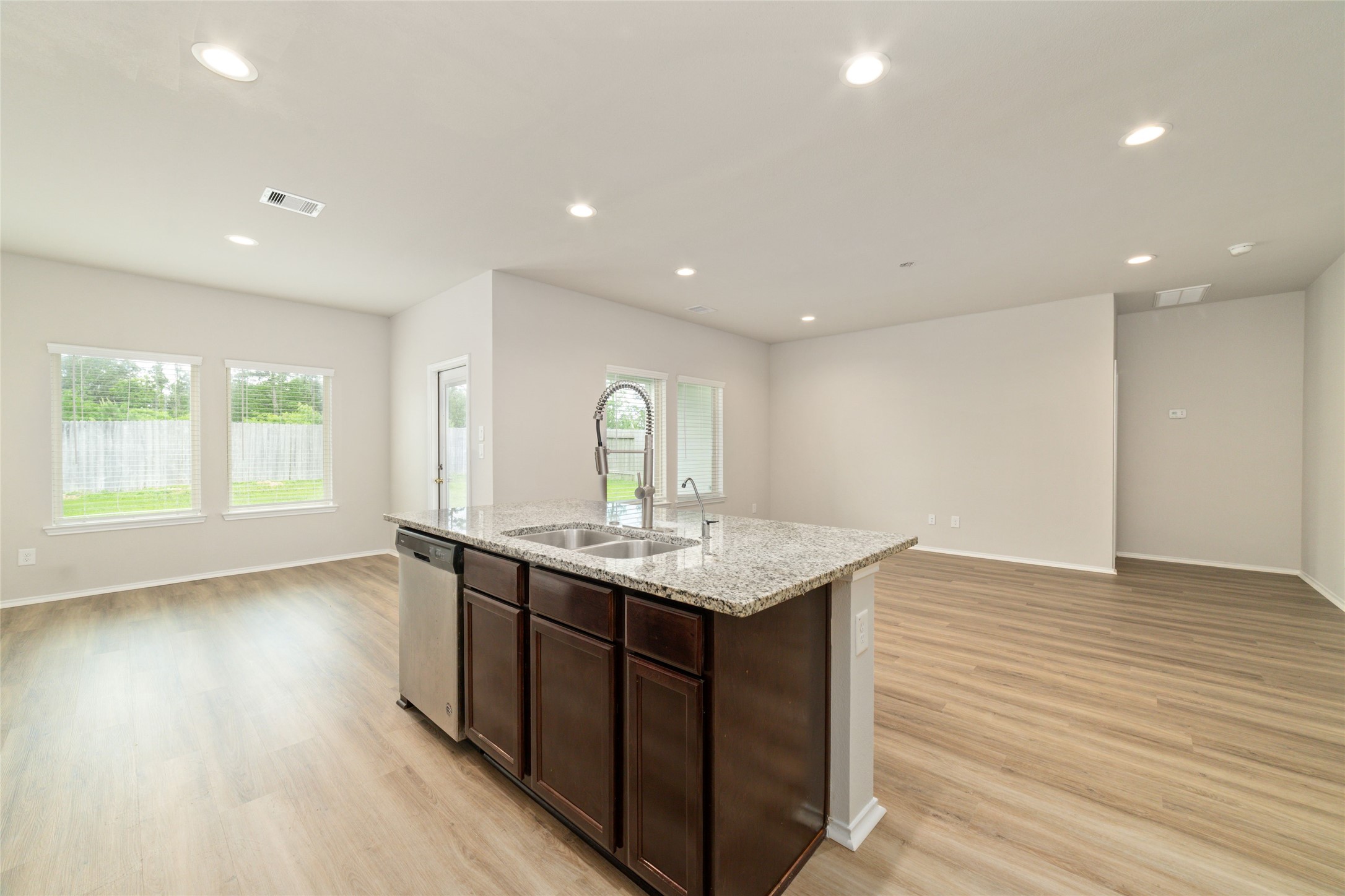 23702 Harrow Field Ln Spring Spring, TX 77373 - Photo 14 of 32 a kitchen with a sink and wooden floor