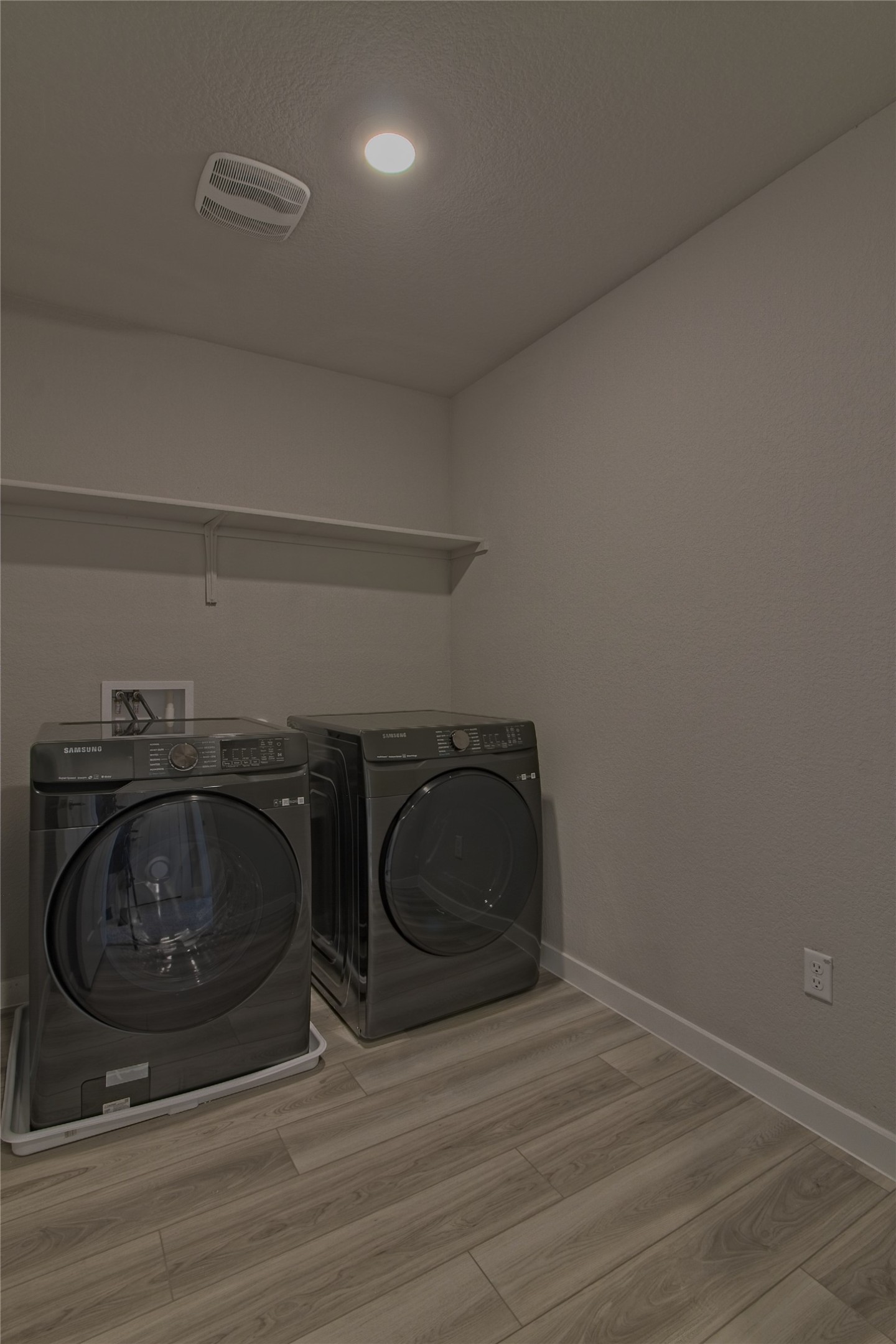 425 Coda Crossing Georgetown, TX 78633 - Photo 14 of 36 Laundry area featuring washer and clothes dryer, light wood finished floors, and recessed lighting