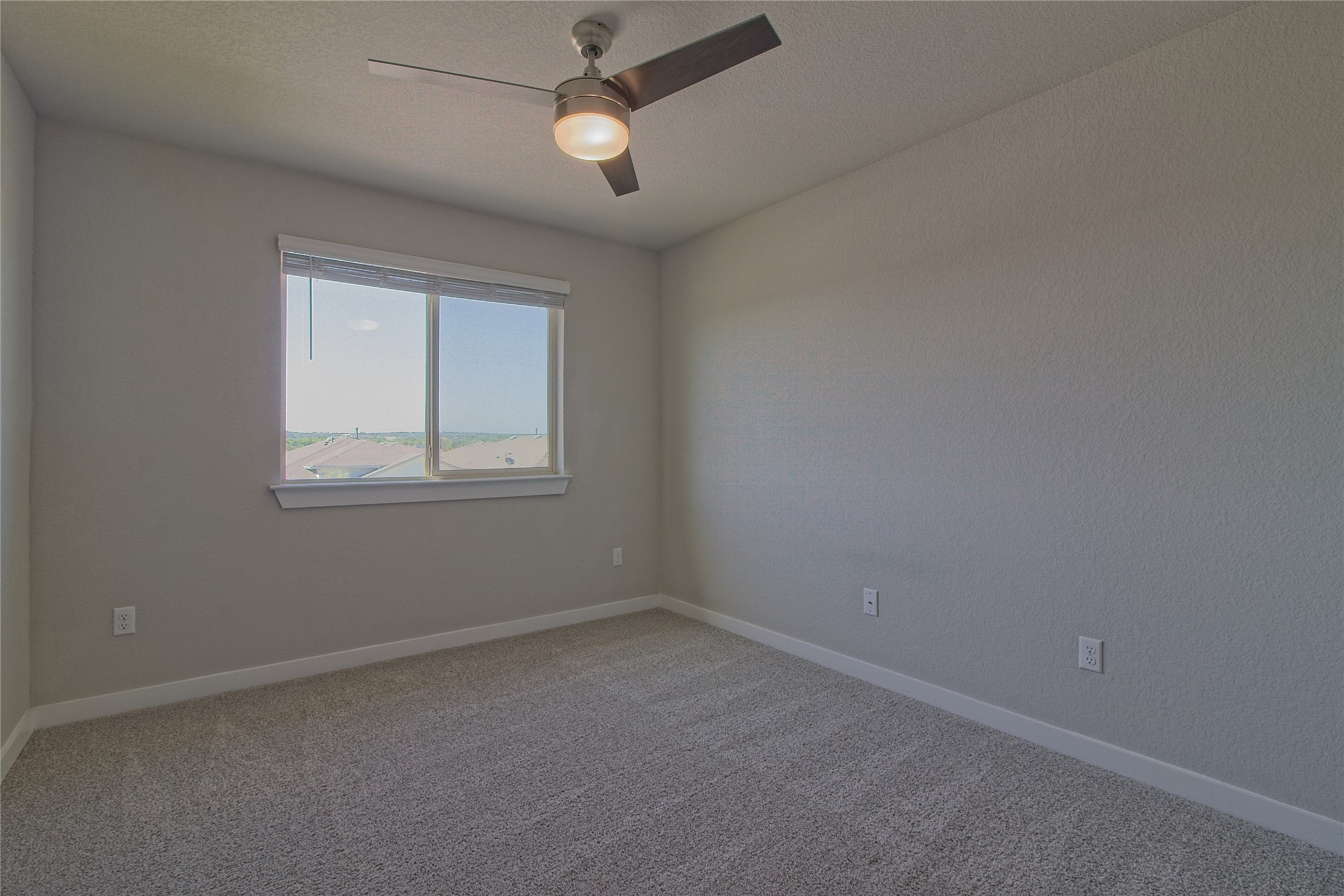 425 Coda Crossing Georgetown, TX 78633 - Photo 19 of 36 Spare room with ceiling fan and light colored carpet