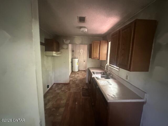 662 Blue Lane Huntingdon, TN 38344 - Photo 11 of 16 a kitchen with a sink a counter top space and cabinets