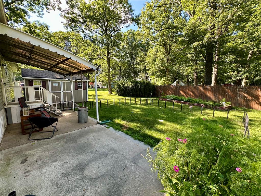 381 Red Oak Lane Bath, PA 18014 - Photo 26 of 27 A spacious backyard with mature trees and a fenced garden offers private outdoor enjoyment.