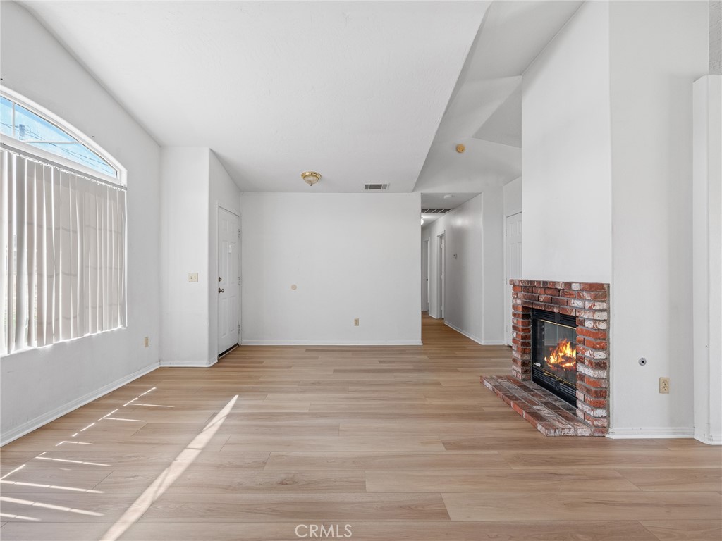 19068 Goleta Street Hesperia, CA 92345 - Photo 20 of 34 a view of a livingroom with a fireplace