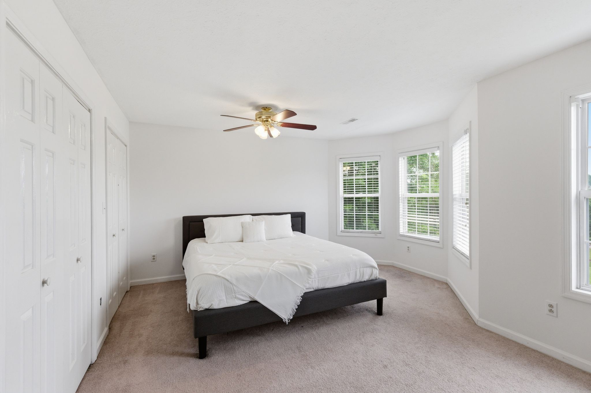615 Vaughan's Gap Road Spring Hill, TN 37174 - Photo 17 of 26 a bed sitting in a bedroom next to a window