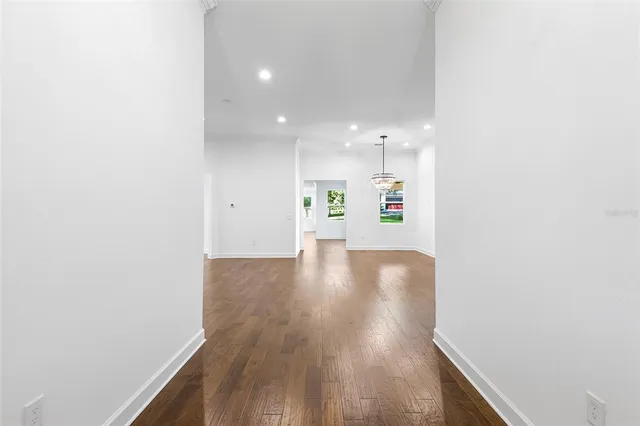 a spacious bathroom with a granite countertop tub sink and mirror
