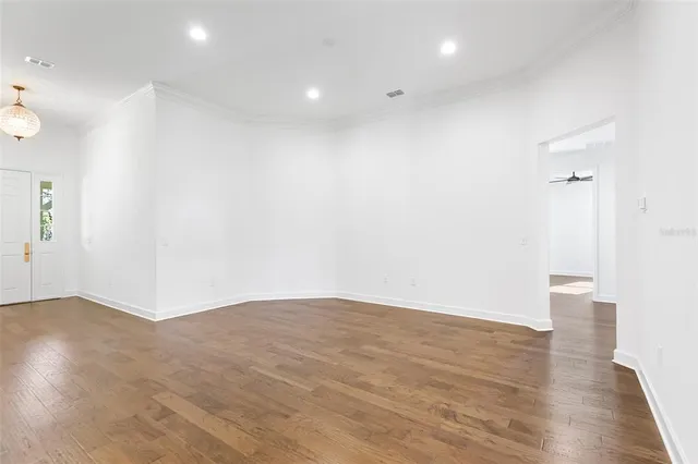 a bathroom with a granite countertop sink a toilet and a mirror