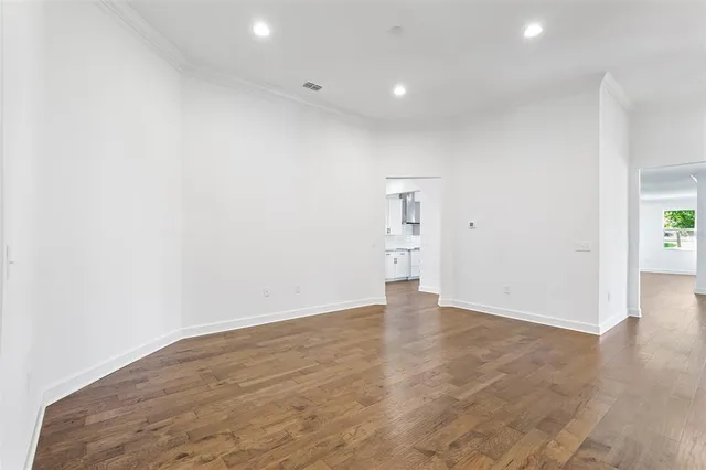 an aerial view of a house with a yard and lake view