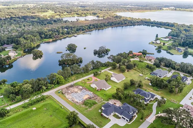 a kitchen with stainless steel appliances granite countertop a sink and a refrigerator