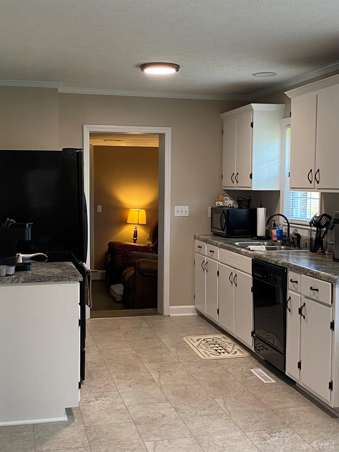 793 Clover Road Hurt, VA 24563 - Photo 11 of 19 a kitchen with a cabinets and white appliances