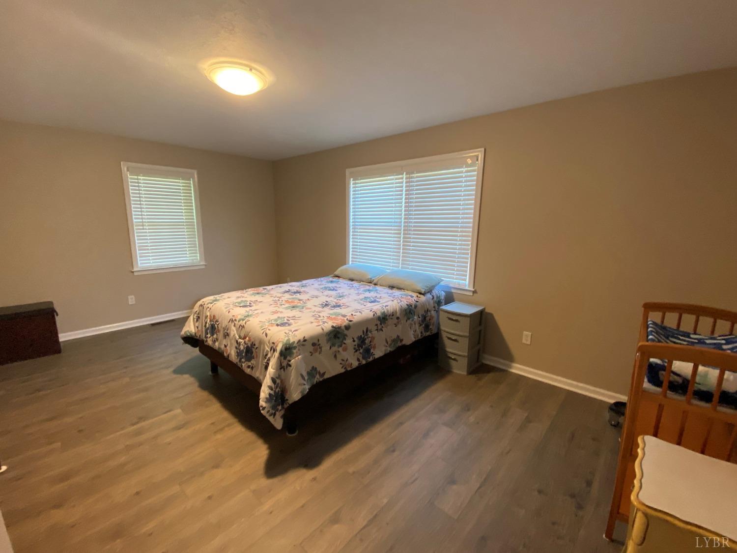 793 Clover Road Hurt, VA 24563 - Photo 15 of 19 a bed sitting in a bedroom next to a window