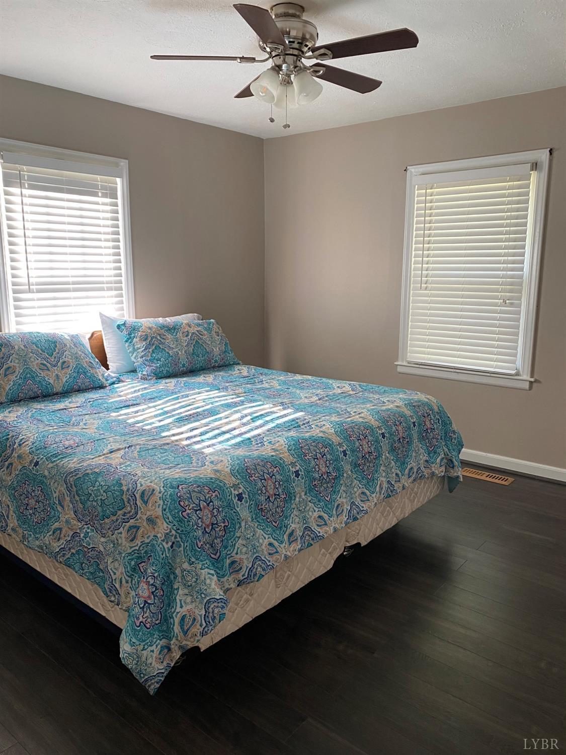 793 Clover Road Hurt, VA 24563 - Photo 6 of 19 a bed sitting in a bedroom next to a window