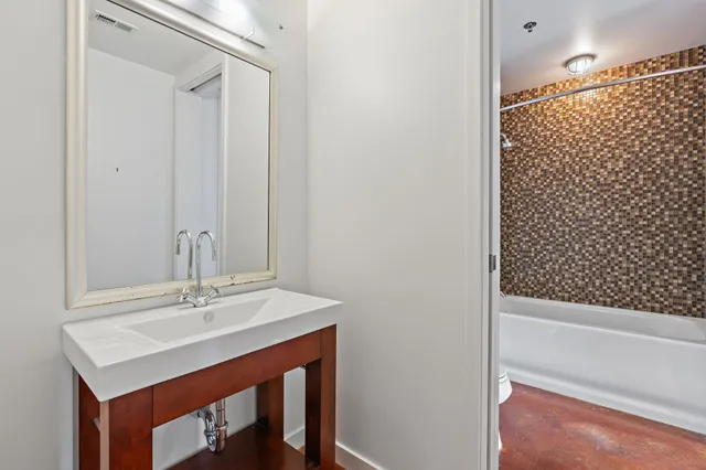 a bathroom with a sink and a mirror