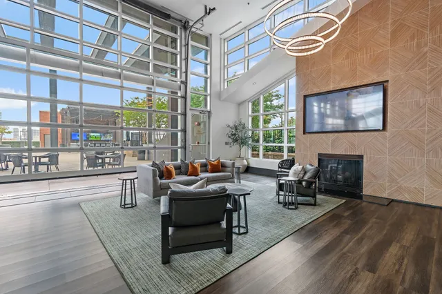 a living room with furniture a fireplace and a table
