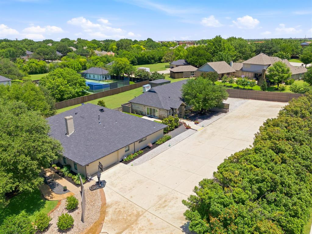 10390 Ridgecrest Street Frisco, TX 75033 - Photo 1 of 40 an aerial view of a house with a garden