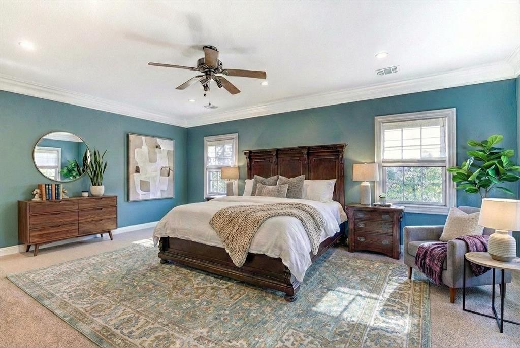 5123 Milam Street Dallas, TX 75206 - Photo 5 of 40 a bedroom with a bed and windows