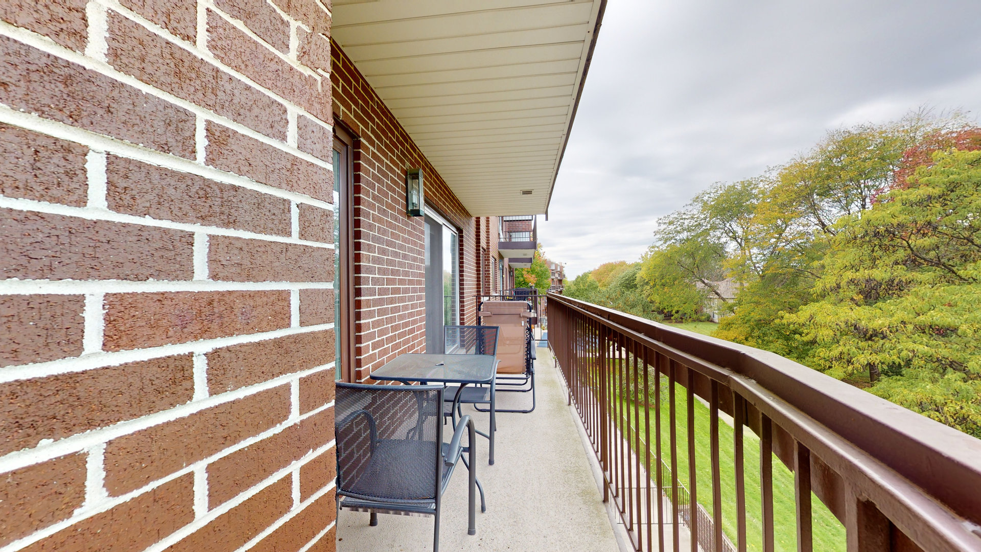 400 East Dundee Road, Unit 307 Buffalo Grove, IL 60089 - Photo 17 of 33 a view of balcony with wooden floor and fence
