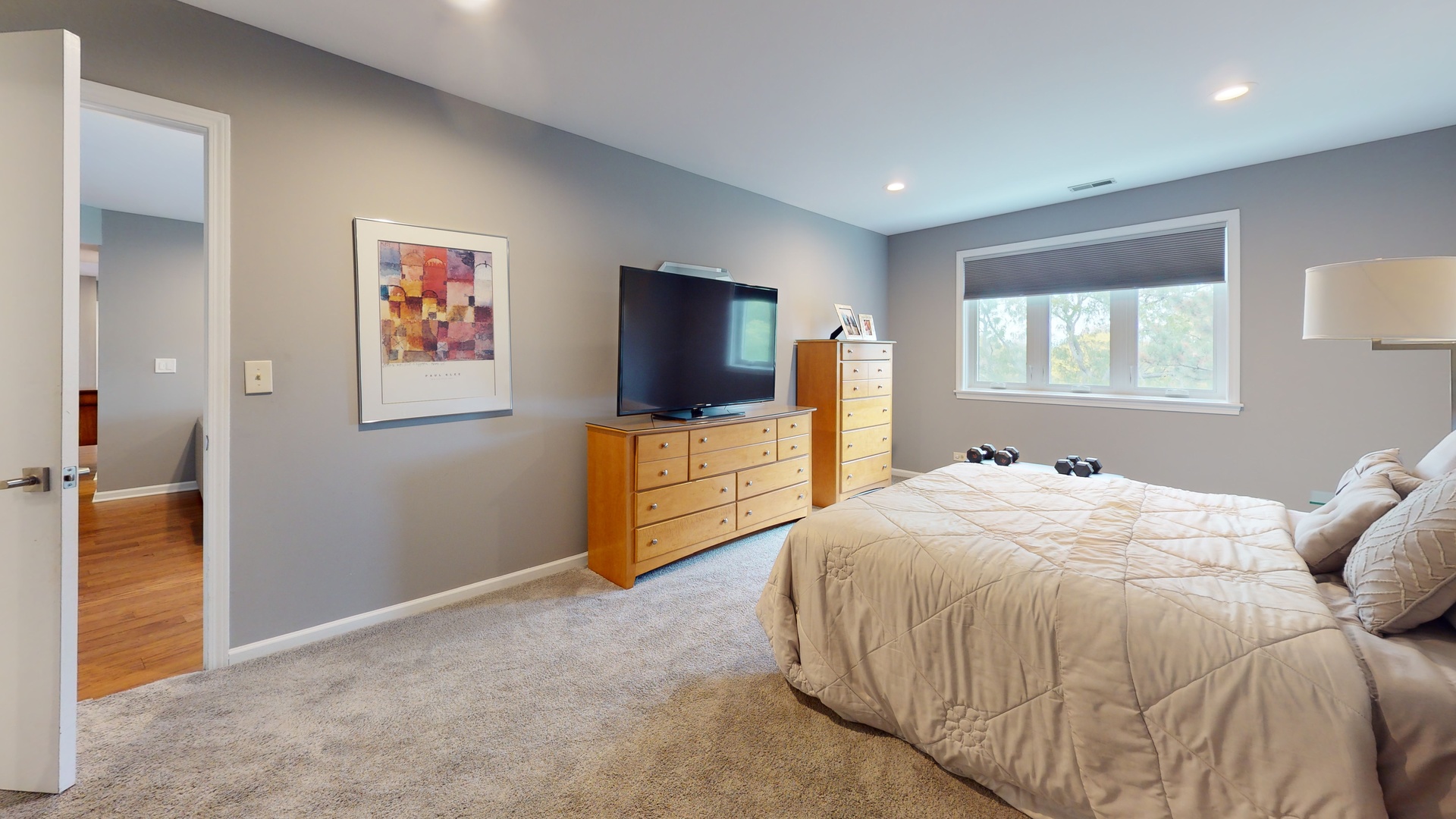 400 East Dundee Road, Unit 307 Buffalo Grove, IL 60089 - Photo 23 of 33 a bedroom with a bed and a flat screen tv