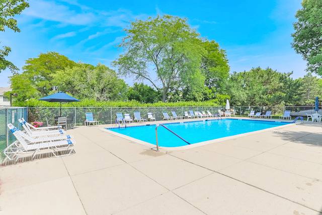 400 East Dundee Road, Unit 307 Buffalo Grove, IL 60089 - Photo 30 of 33 a view of a swimming pool and lounge chairs