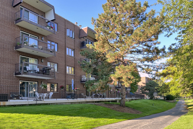400 East Dundee Road, Unit 307 Buffalo Grove, IL 60089 - Photo 32 of 33 a building view with swimming pool in front of it