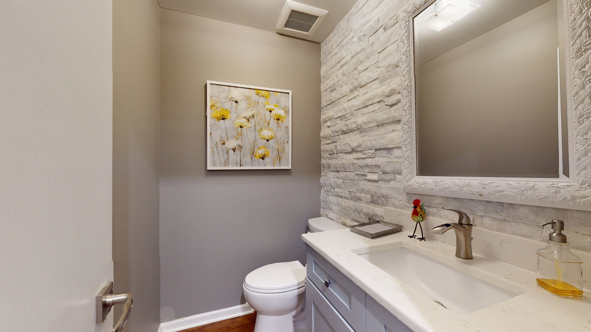 400 East Dundee Road, Unit 307 Buffalo Grove, IL 60089 - Photo 5 of 33 a bathroom with a sink toilet and mirror