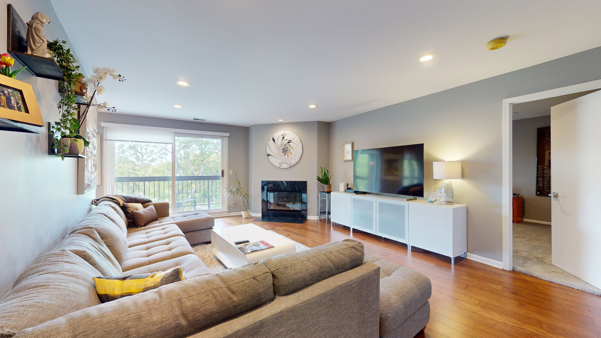 400 East Dundee Road, Unit 307 Buffalo Grove, IL 60089 - Photo 6 of 33 a living room with furniture flat screen tv and a large window