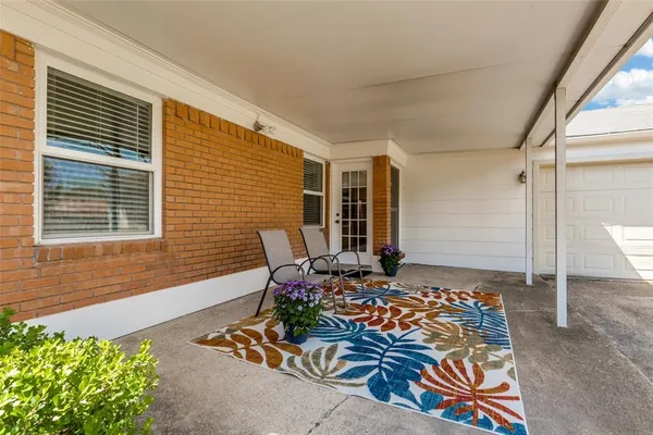 a outdoor space with patio furniture and potted plants
