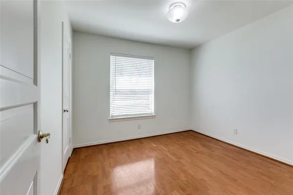 a bathroom with a granite countertop toilet sink and mirror