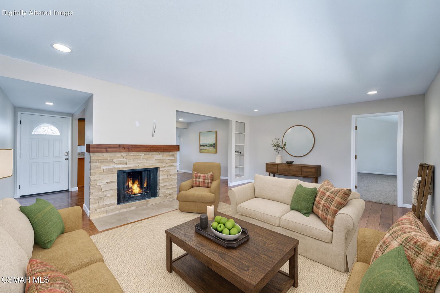 560 Randy Drive Newbury Park, CA 91320 - Photo 12 of 39 a living room with furniture a fireplace and a table