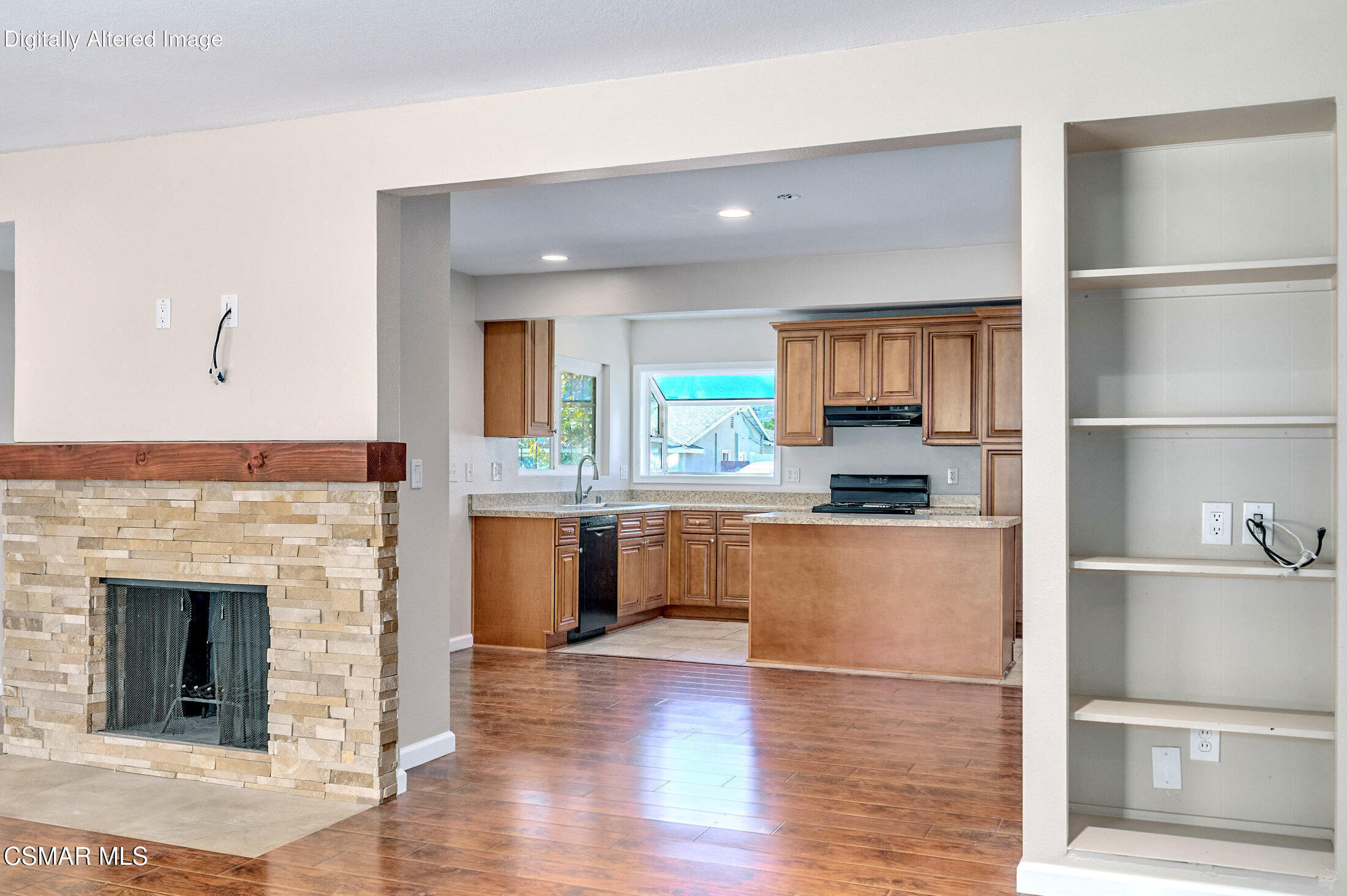 560 Randy Drive Newbury Park, CA 91320 - Photo 21 of 39 a kitchen with granite countertop a refrigerator and a stove top oven