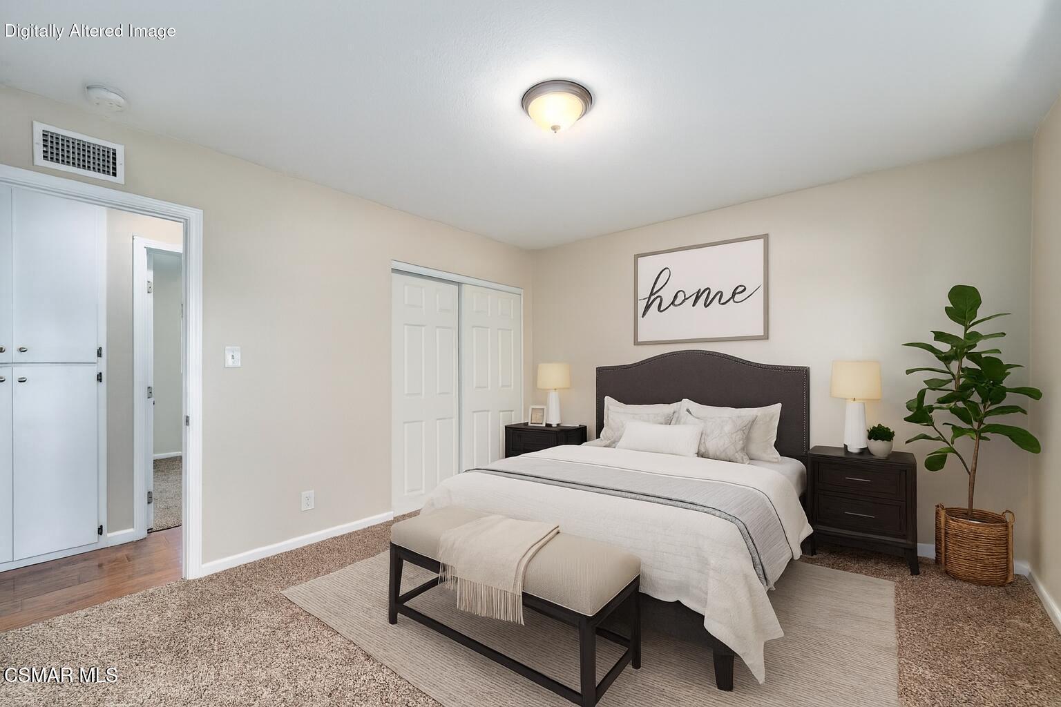 560 Randy Drive Newbury Park, CA 91320 - Photo 25 of 39 a bedroom with a bed and a potted plant