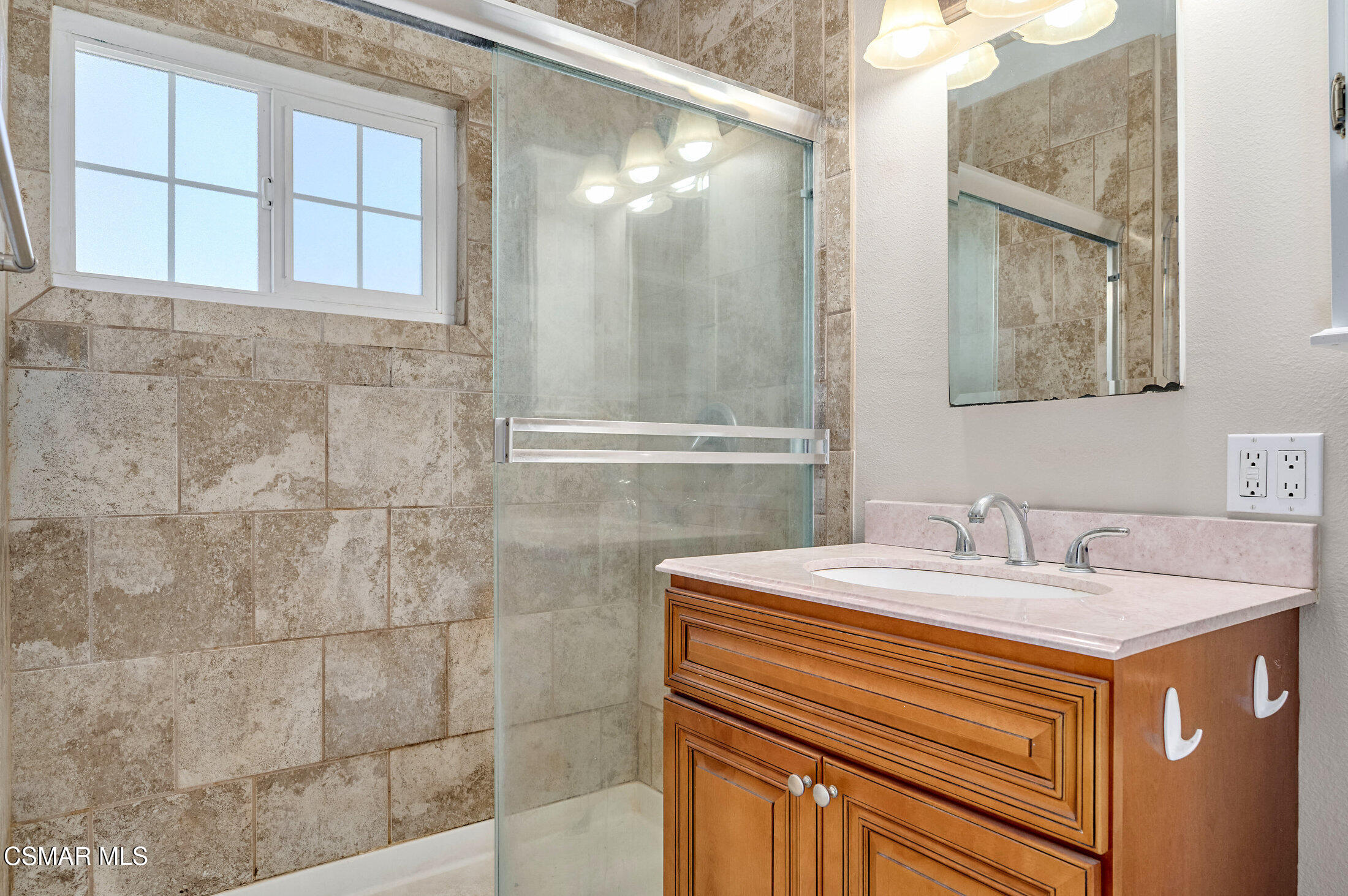 560 Randy Drive Newbury Park, CA 91320 - Photo 27 of 39 a bathroom with a sink and a mirror