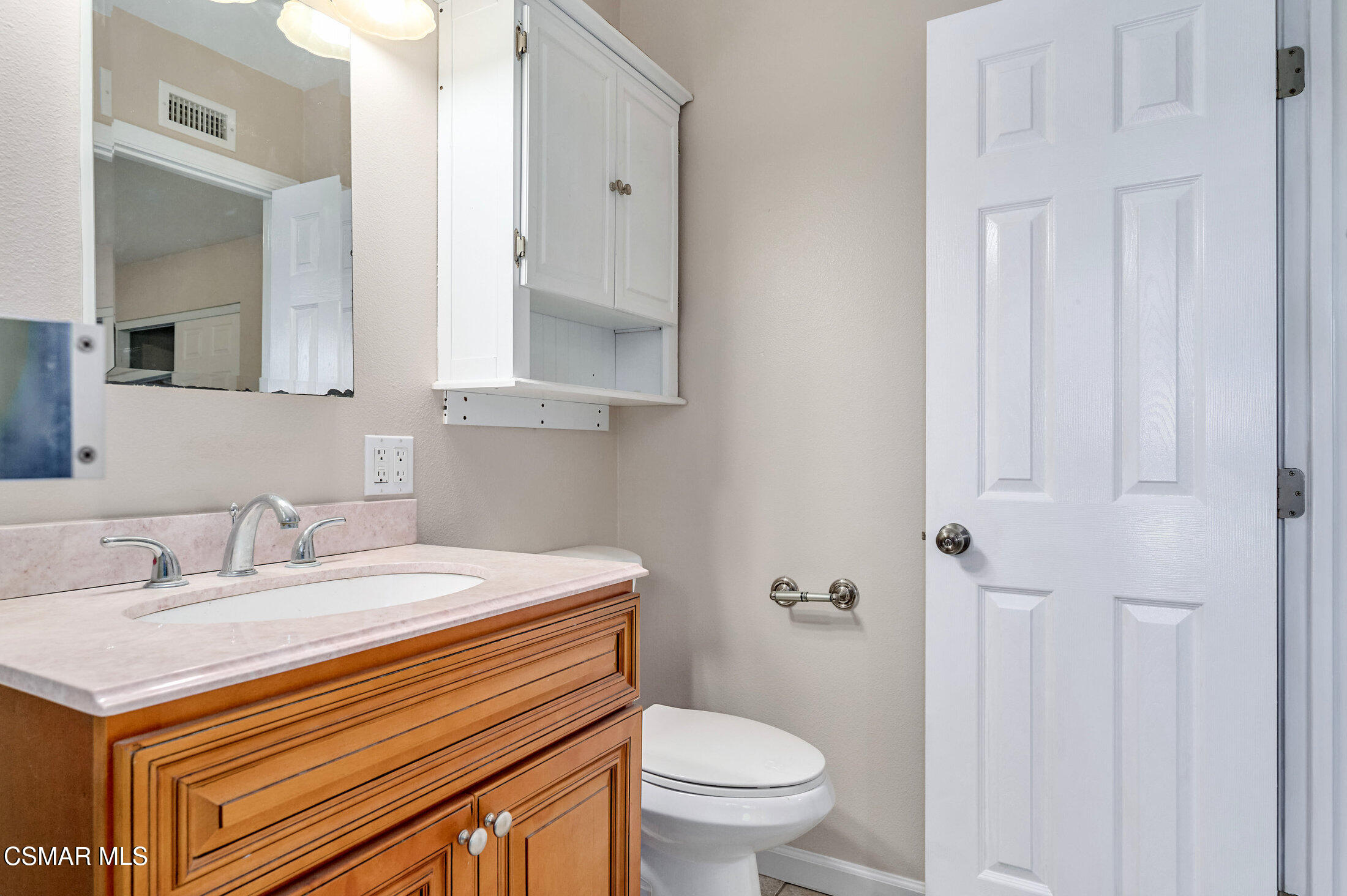 560 Randy Drive Newbury Park, CA 91320 - Photo 28 of 39 a bathroom with a sink toilet and vanity