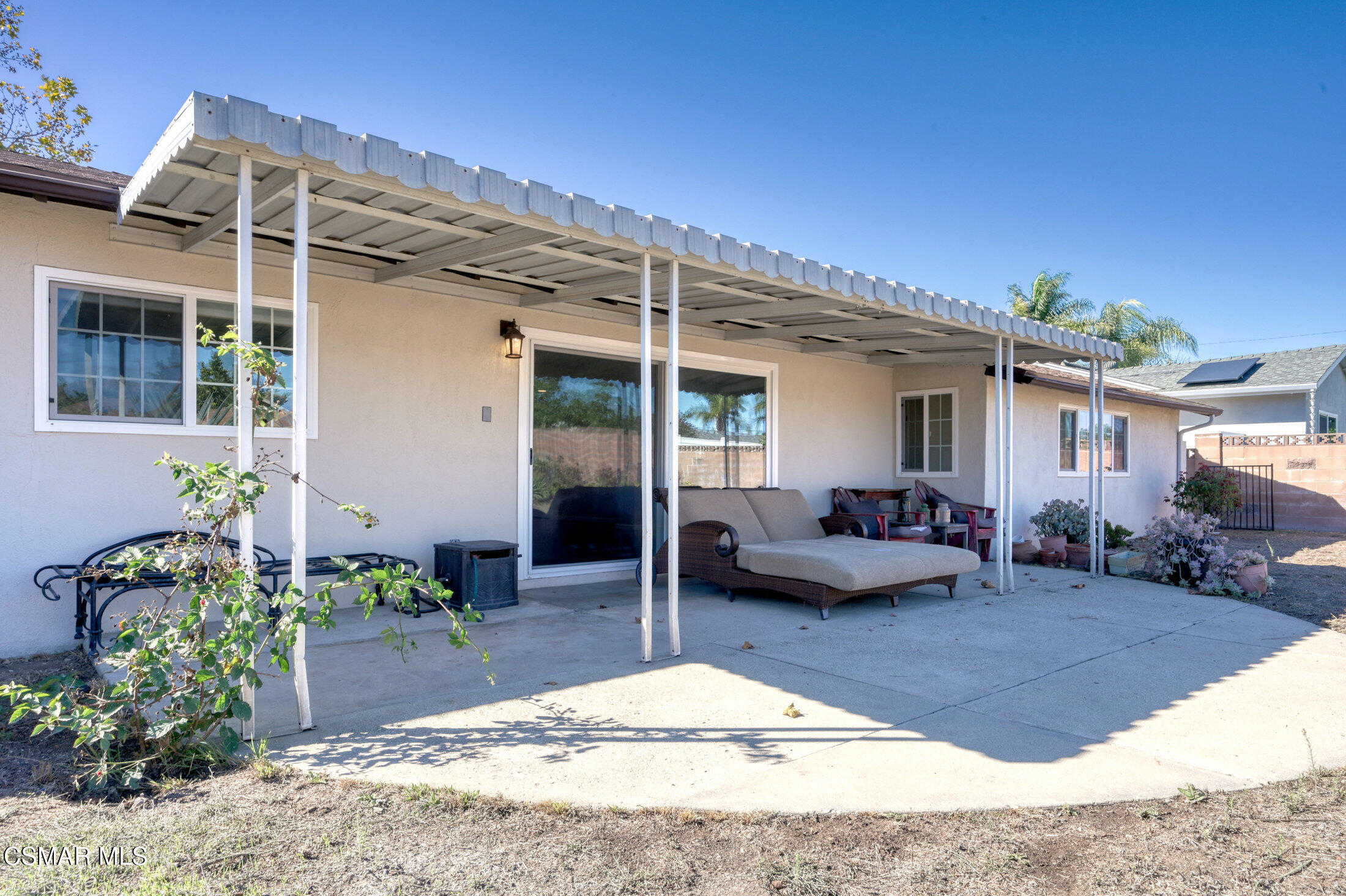 560 Randy Drive Newbury Park, CA 91320 - Photo 33 of 39 a backyard of a house with potted plants and outdoor seating