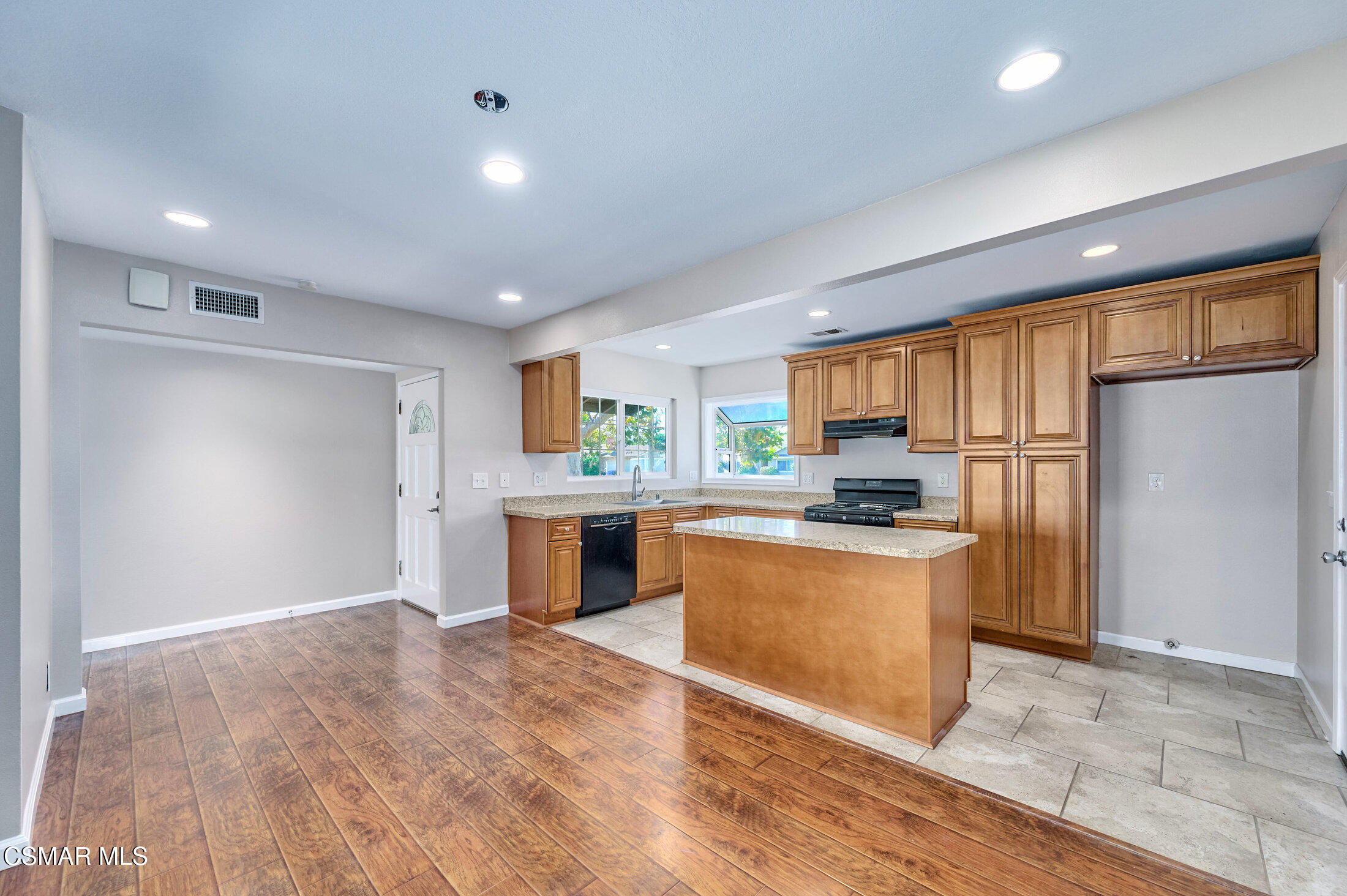 560 Randy Drive Newbury Park, CA 91320 - Photo 6 of 39 a large kitchen with stainless steel appliances granite countertop a refrigerator and a stove top oven