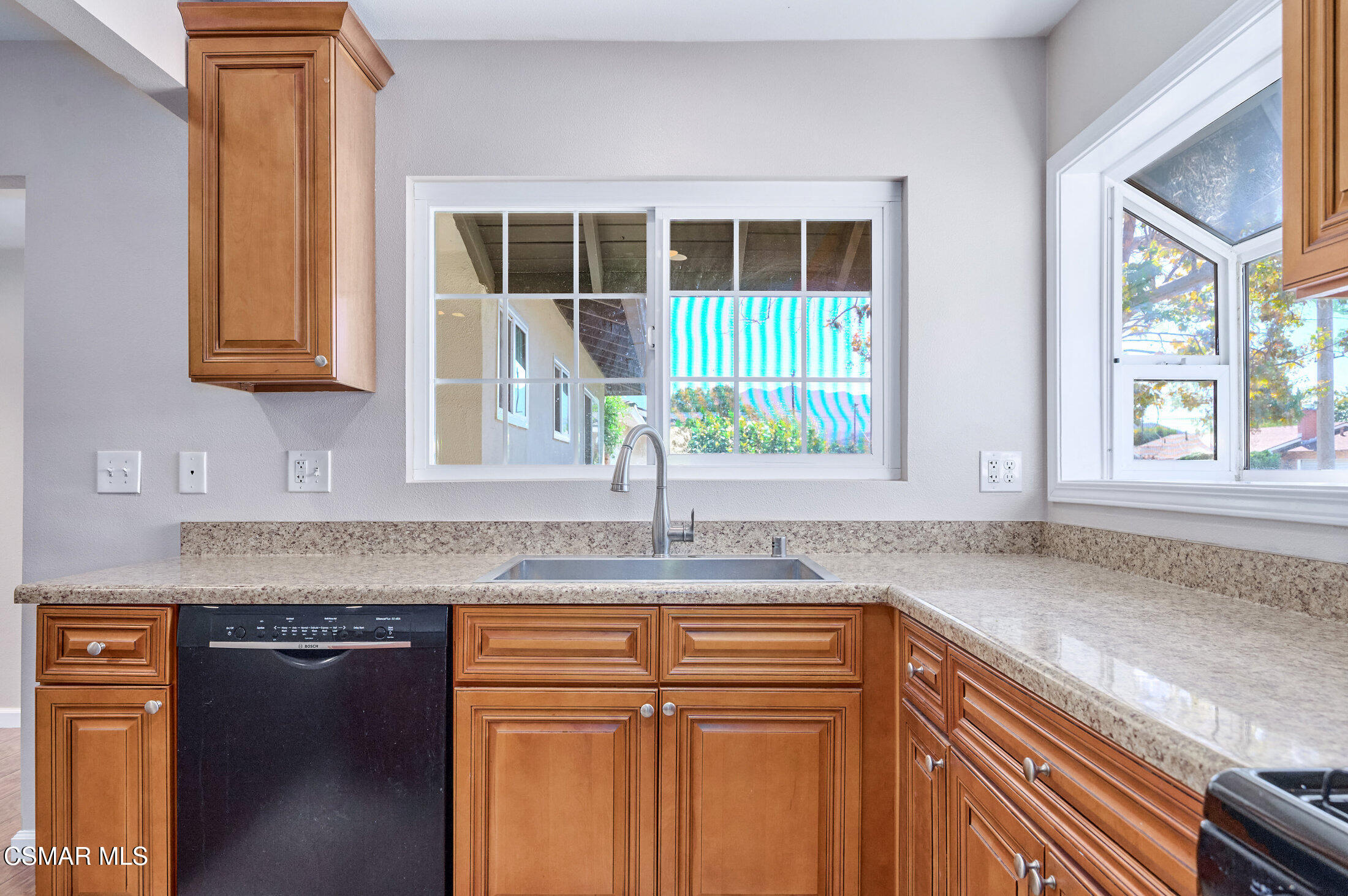 560 Randy Drive Newbury Park, CA 91320 - Photo 9 of 39 a kitchen with granite countertop a sink and a window