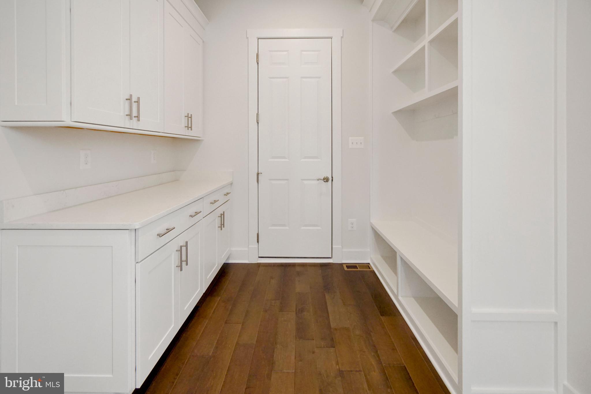 7405 Copper Lake Drive Hanover, MD 21076 - Photo 19 of 36 a view of hallway with wooden floor