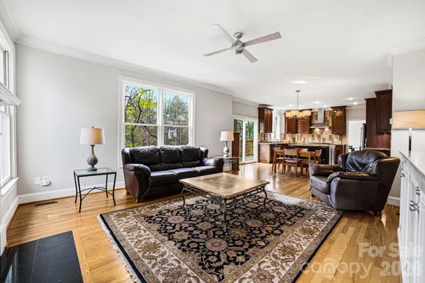 a living room with furniture rug and window
