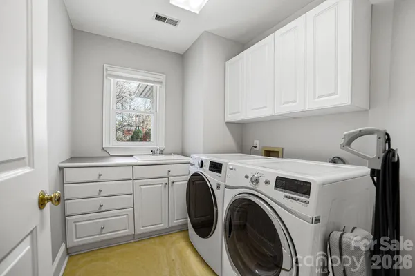 a view of storage and utility room with washer and dryer