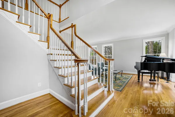 a view of entryway dining room and hall with wooden floor