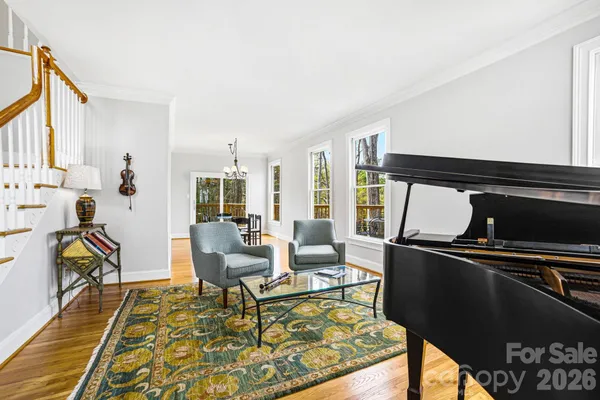 a living room with furniture rug and a table