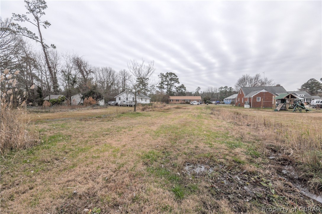 1514 Dandy Loop Road Yorktown, VA 23692 - Photo 9 of 29 a view of a field with trees in the background