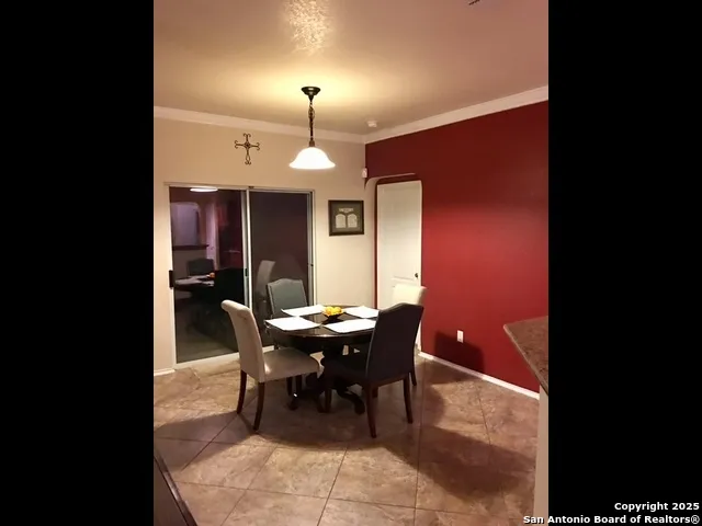 a view of a dining room with furniture