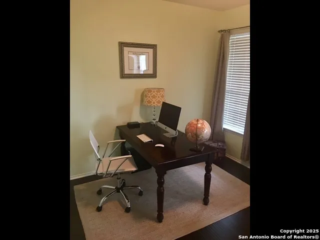 a view of a workspace with furniture