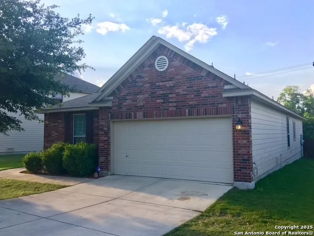 a front view of a house with yard