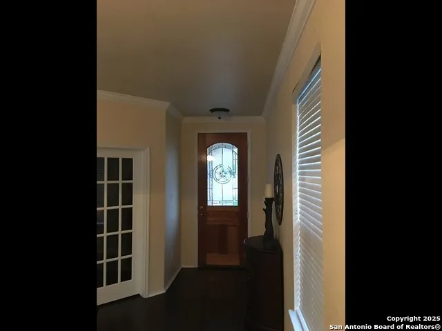 a view of wooden floor and windows in a room